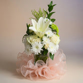 Bouquet of flowers with a pink ribbon on a neutral background