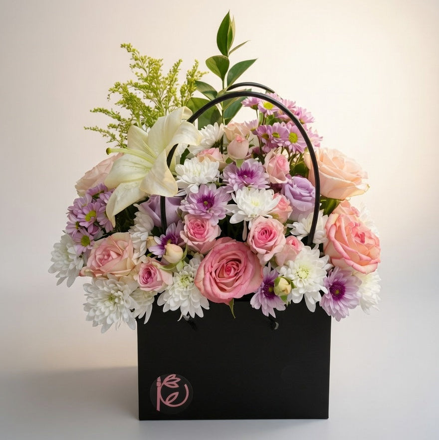 Floral arrangement in a black box with a soft background
